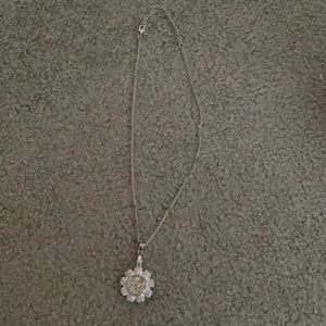 Flower necklace with little plastic jewels in it